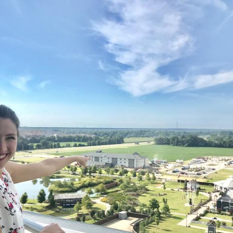 Katie Jarvis, Discovery Park of America Marketing Assistant, points at the new Sleep Inn and MainStay Suites by Choice Hotels, opening next month.